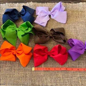 Lot of 7 solid color large bows.